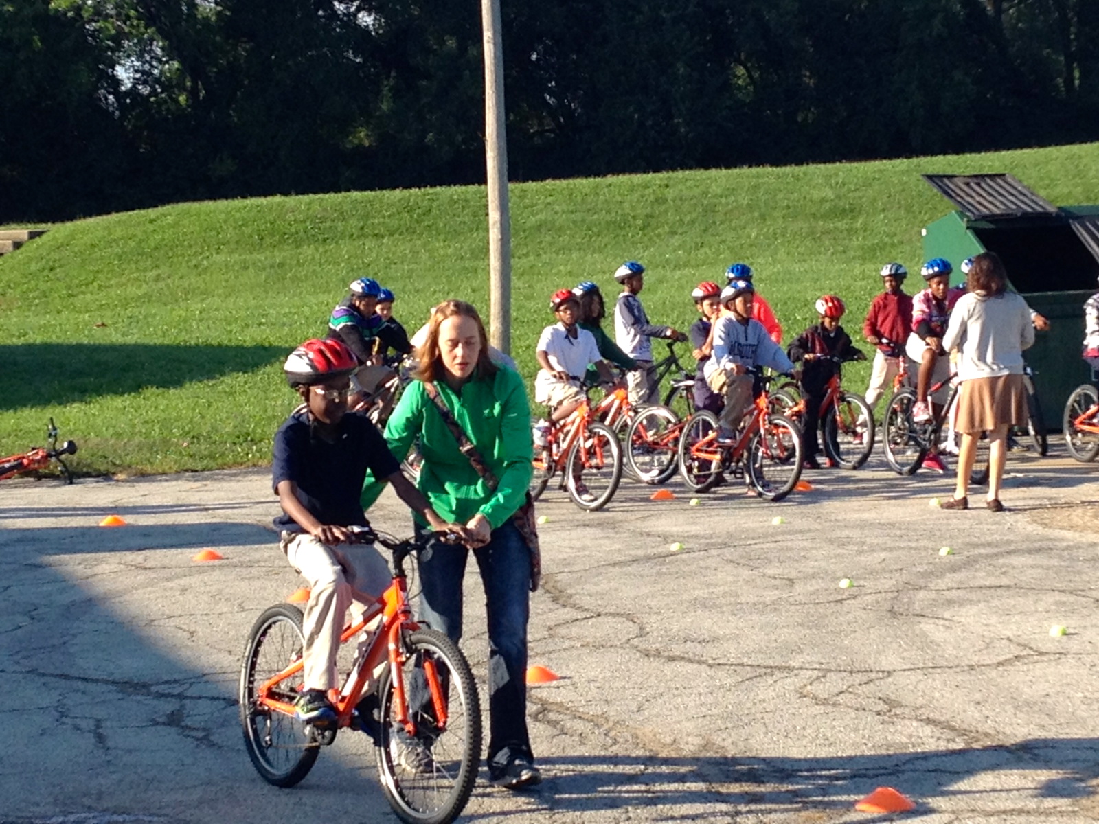 A student learns to ride a bicycle in 2014
