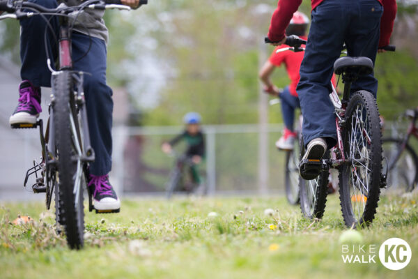 Kids riding in the grass