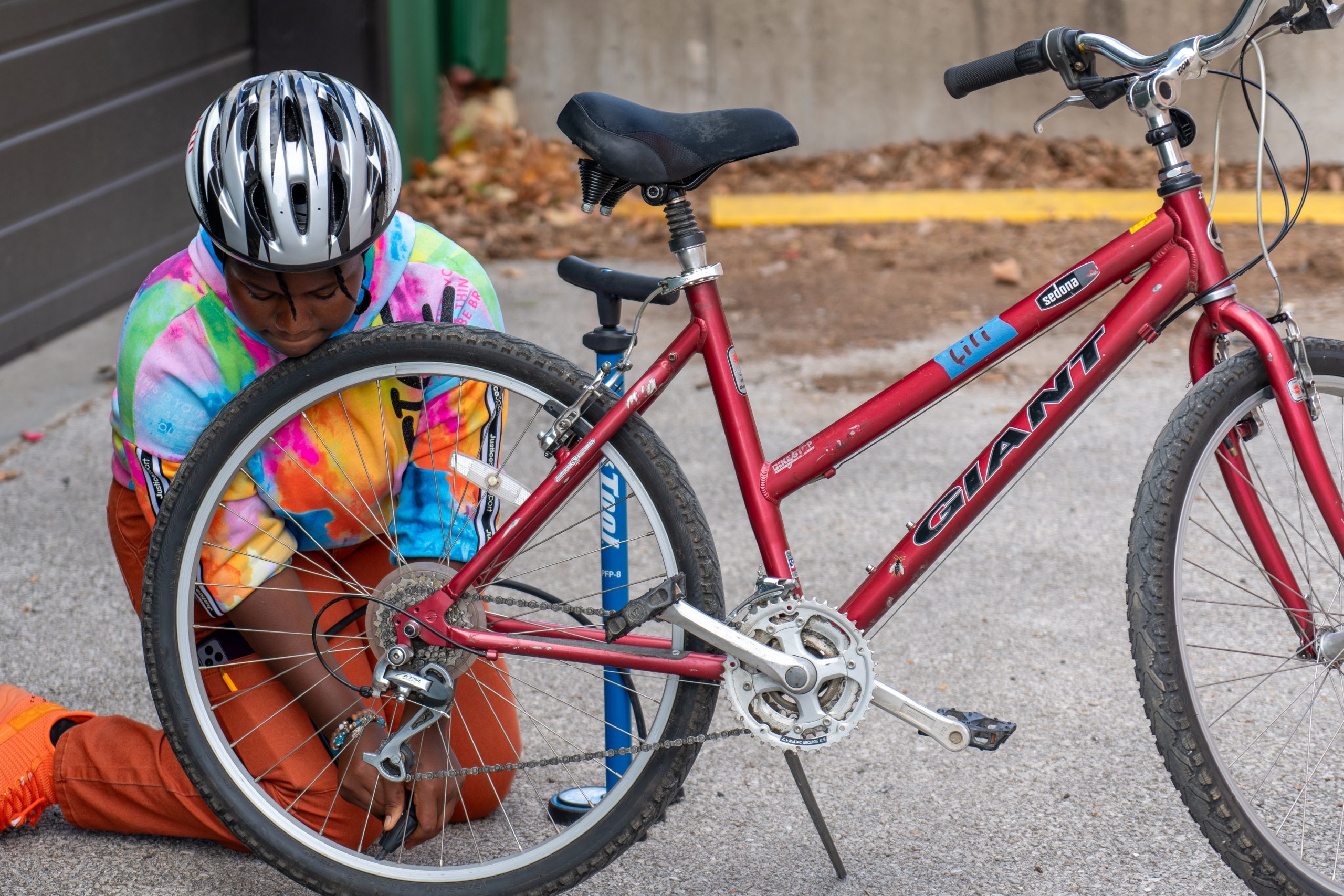 EHS Bike Club student practices fixing flats.