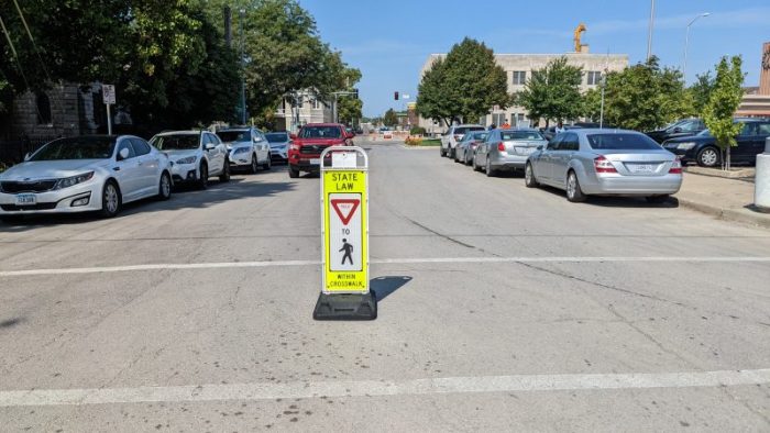 It's Missouri state law that drivers must yield to pedestrians in marked AND unmarked crosswalks.